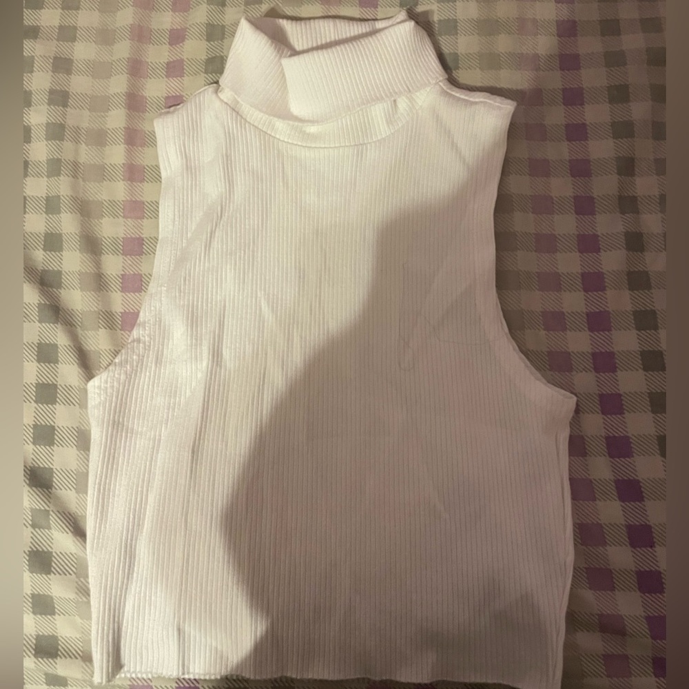 White turtle neck sleeveless shirt
